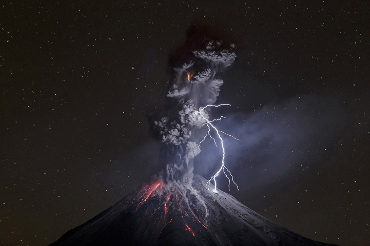 Colima Volcano in Mexico shows a powerful night explosion with lightning, ballystics and some incandescent rockfalls. Photo taken on dec. 13 at 22:24 hours, 12.5 km away from the crater near a lagoon named Carrizalillos on Comala municipality in the state of Colima. Colima Volcano had a period of enormous activity on july of 2015, at least 700 inhabitants were evacuated from their settlements. The volcano mantains activity with 3 to 6 explosions by day.  Lightning on Colima Volcano explosions became common on last months. This particular lightning is more than 600 meters long, so the big light made clear some details of the south portion of volcano. It's an 8 seconds shot, time enough to catch the explosion and the lightning. Photo: Sergio Velasco